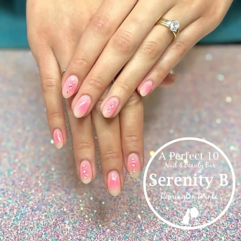 Simple and easy summer manicure with pastel yellow and pink aura effect. 