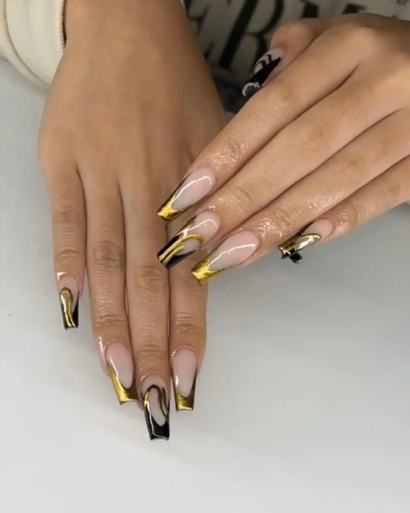 Simple nail art for Prom night with black and gold French tips. 