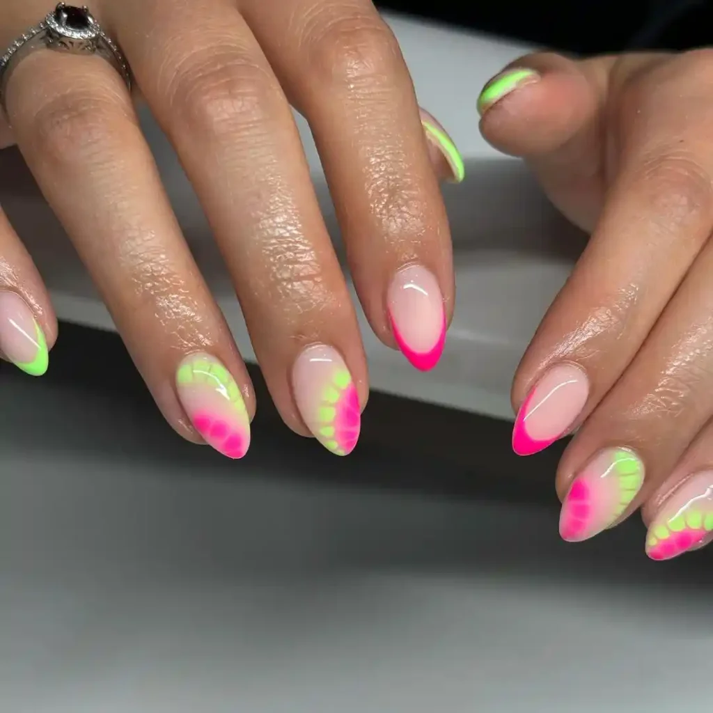 Short holiday manicure idea with a nude base and neon abstract art. 