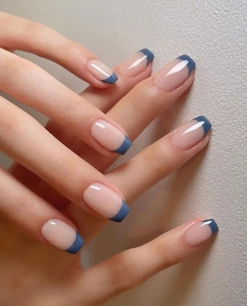 Short coffin tips with a muted blue French manicure.