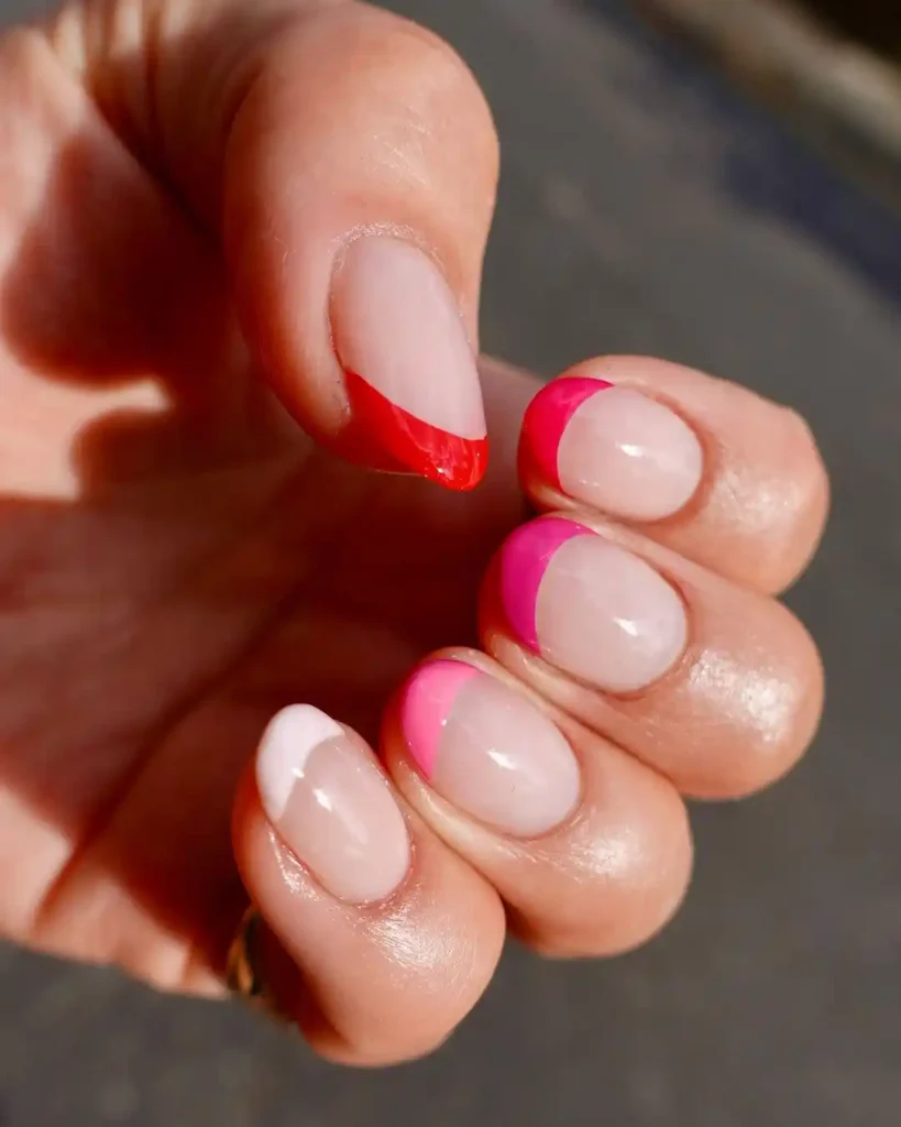 Bright-colored French tips on short nails for summer. 