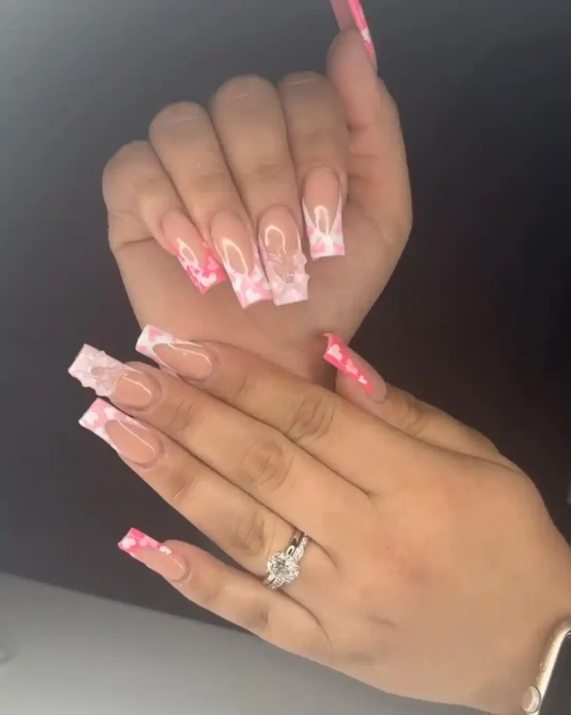 Cute cherry French tips with nude pink nail color. 