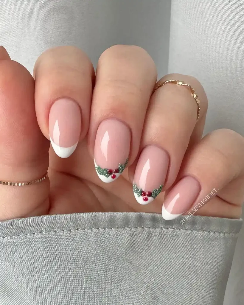 White French tips on short nails with Christmas nail art.