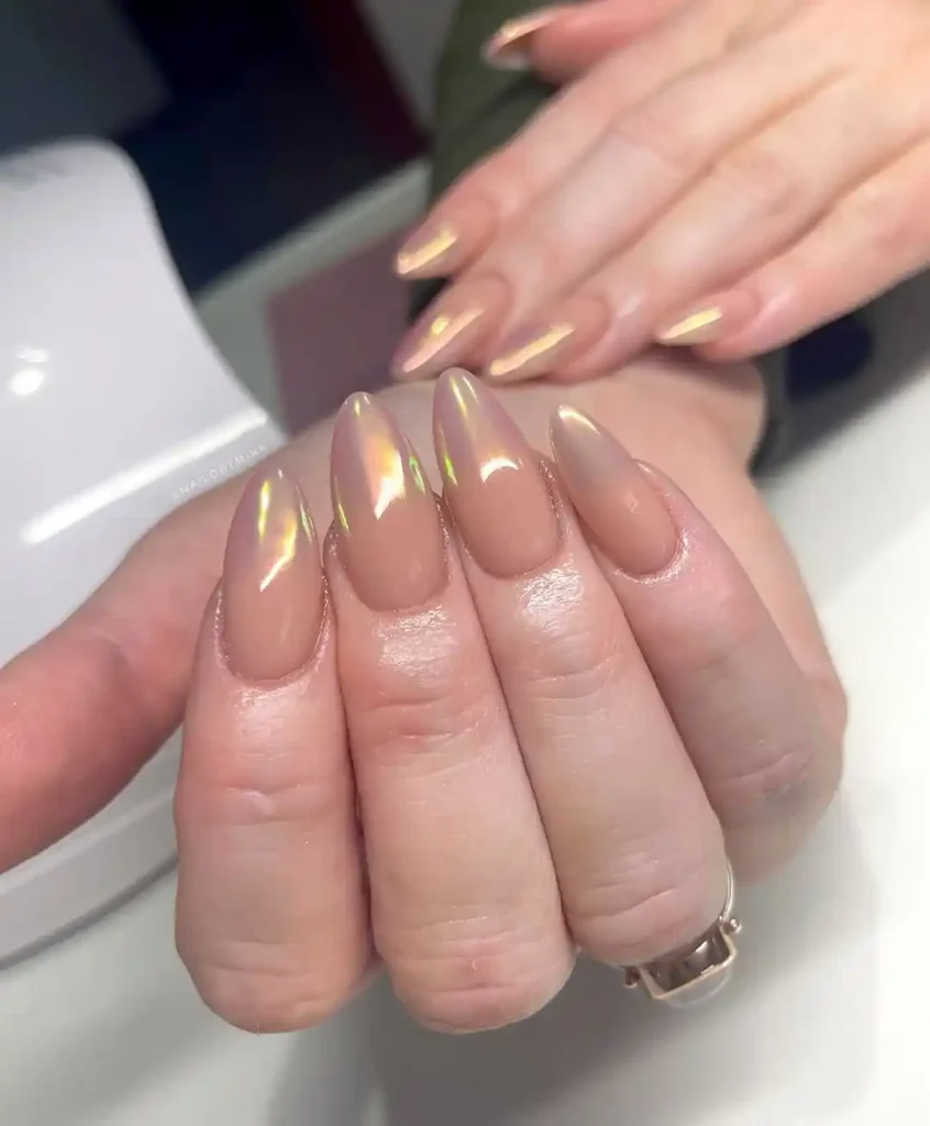 Beautiful summer nude nail color with a chrome effect