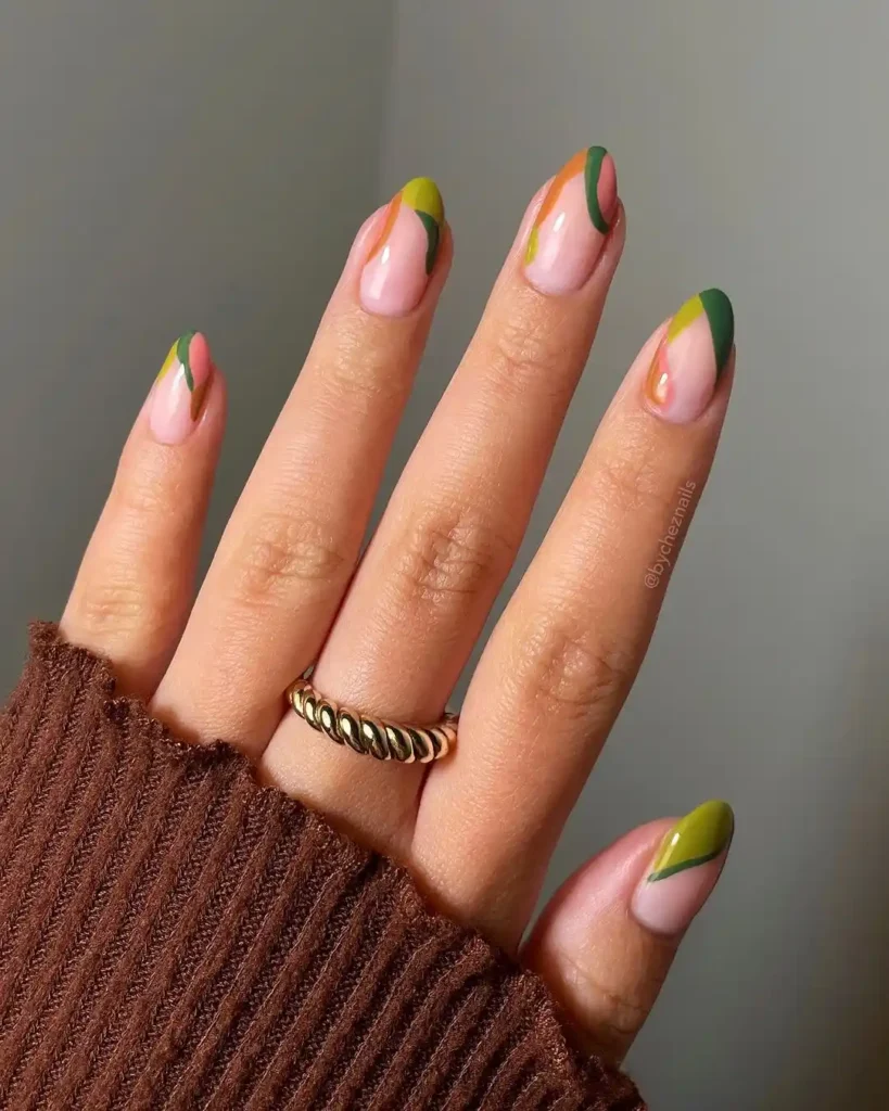 Simple fall nail art with neutral brown, green, and dark green colors. 
