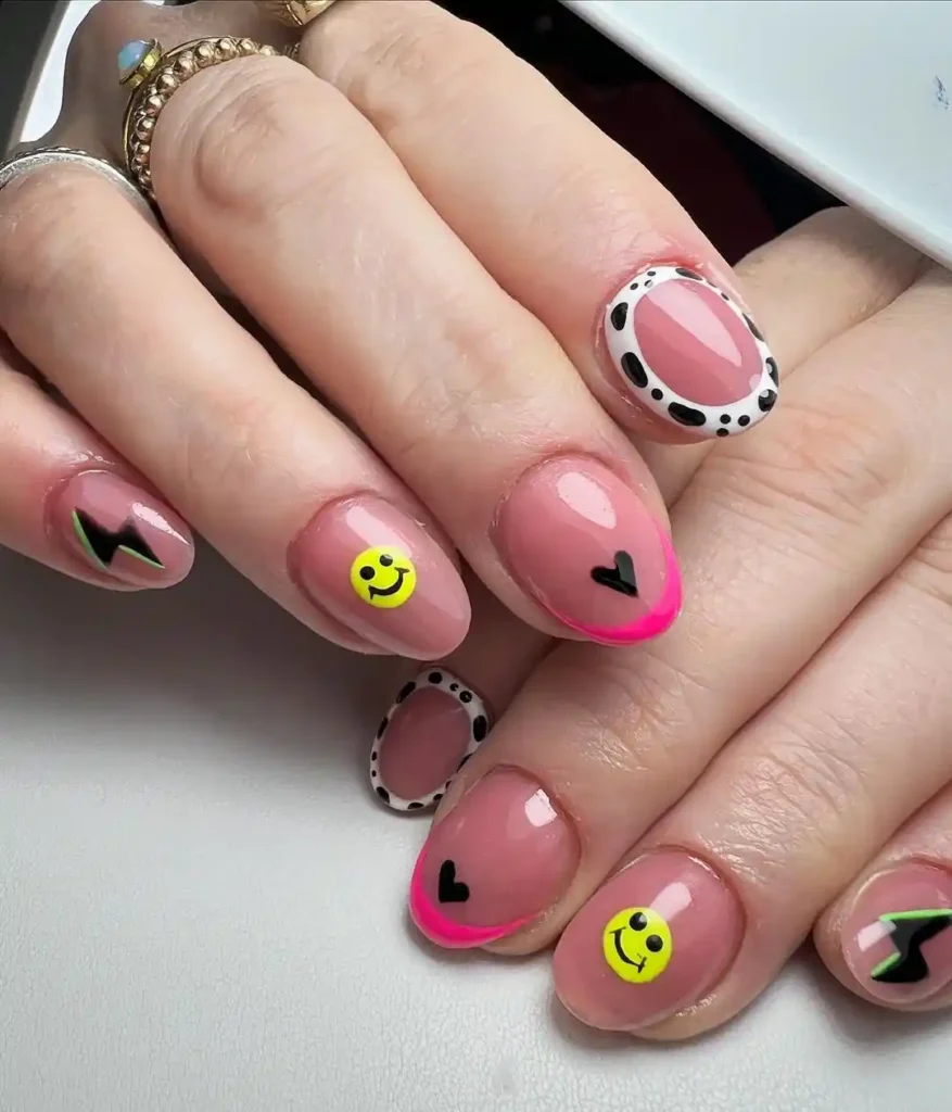 Pink nails with French tips, cow print outline, and thunder nail designs.