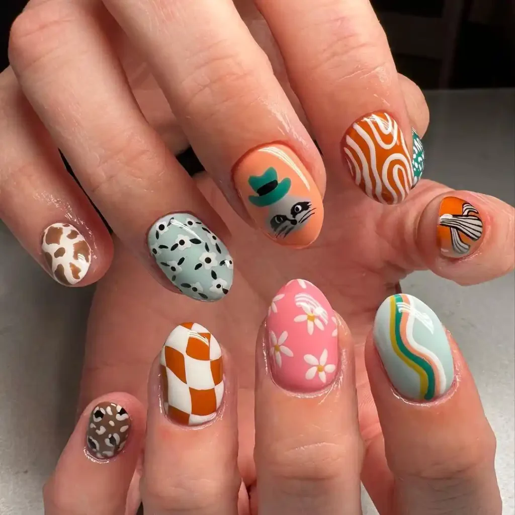 Hand-painted country nails with cactus, swirls, and check nail designs.