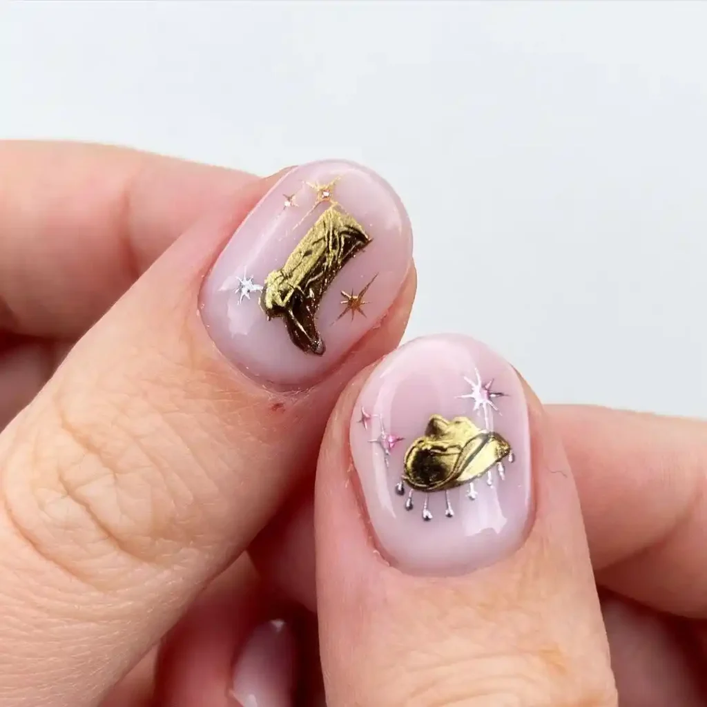 Hand-painted gold chrome cowboy hat and boots designs on short nude nails.