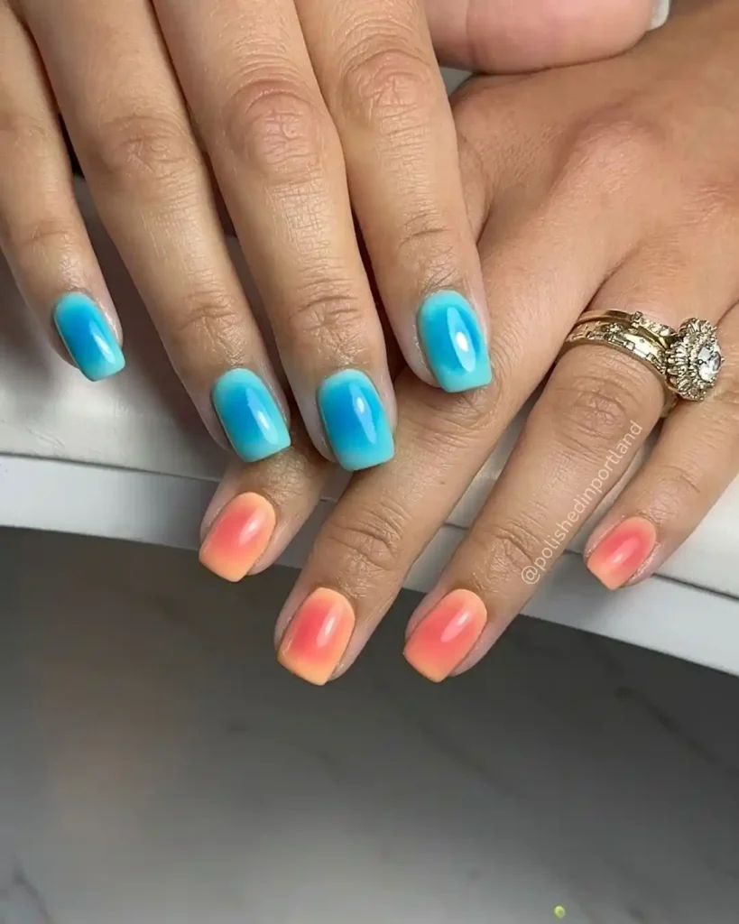 Aura nail effect with blue and pink nail colors for a contrasting manicure. 