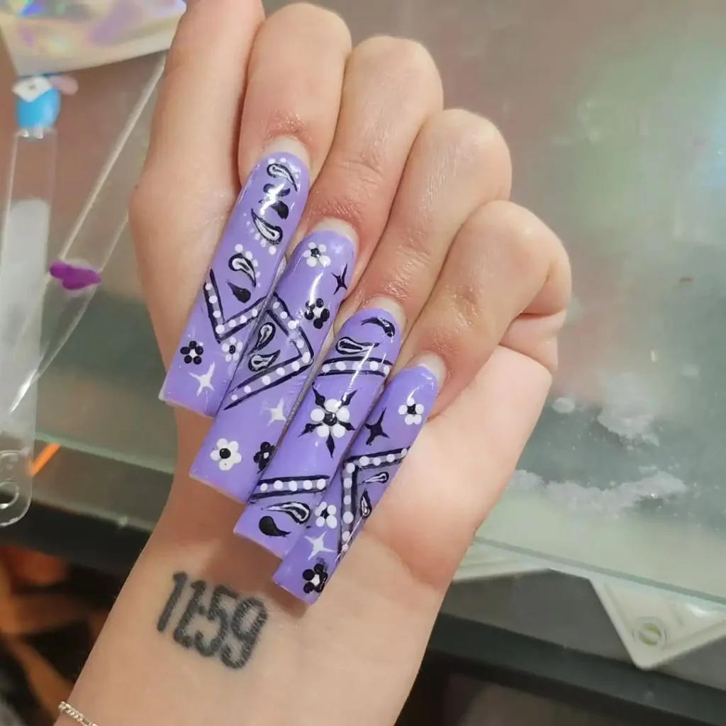 Extra long square nails with purple bandana nail art.