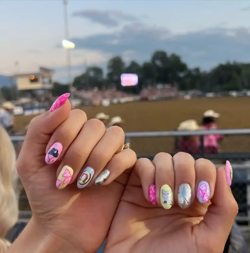 Western nails with cowgirl, hat, and metallic nail art for a country fair. 