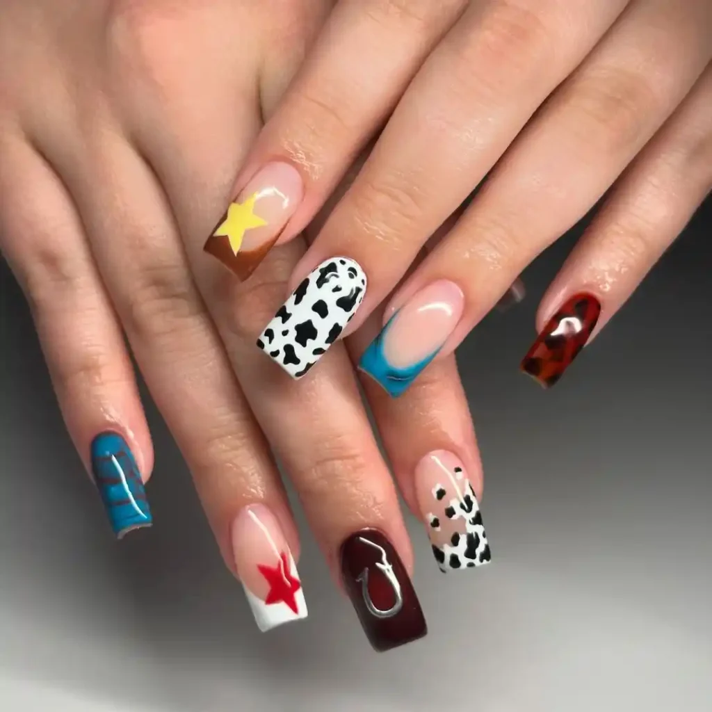 Cow print, star pattern, and French tips on medium square nails. 