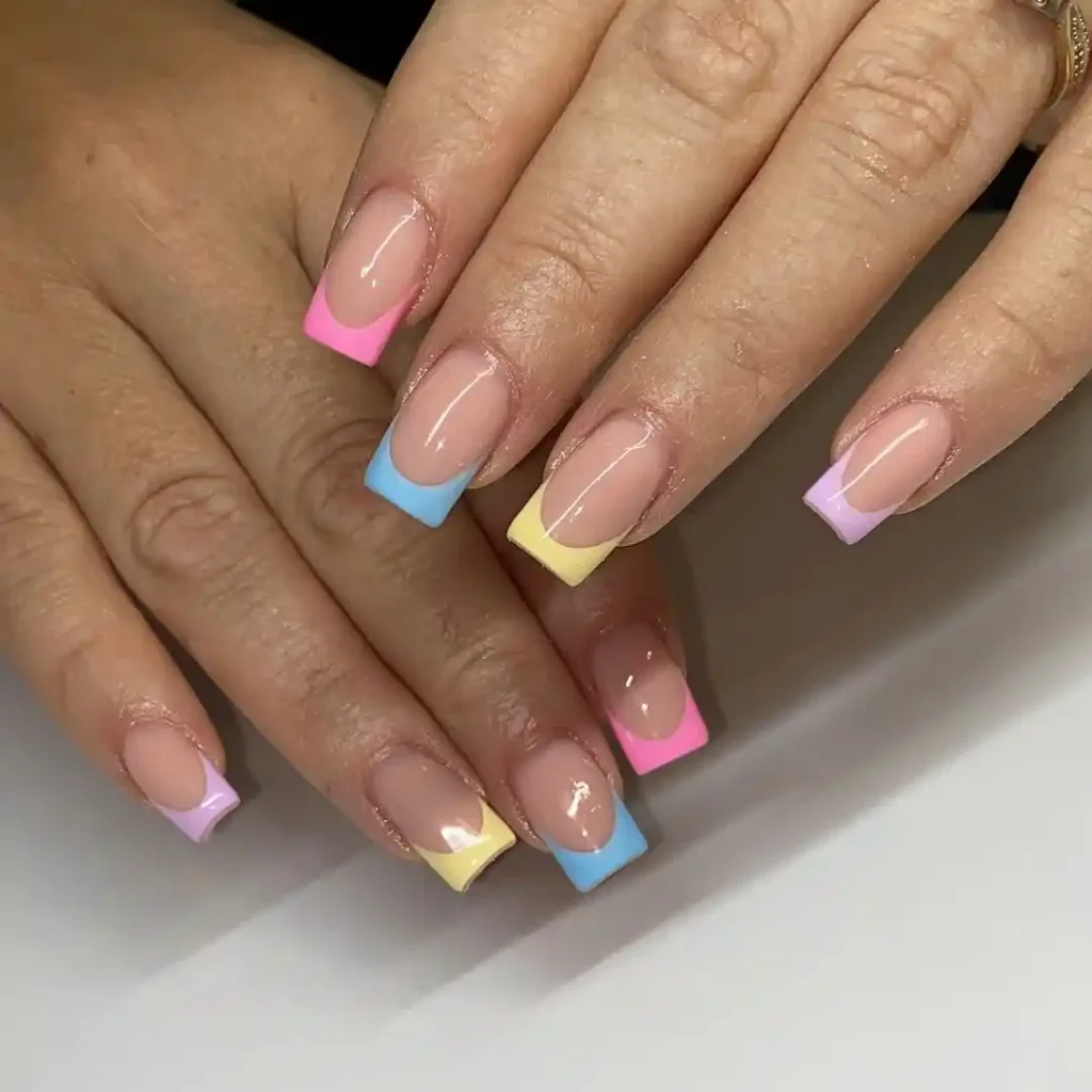 Short square nails with pastel French tips. 