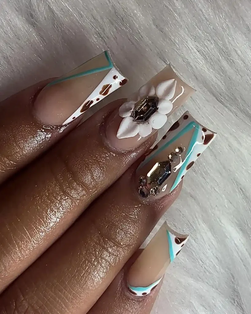 Acrylic nails with V-tips and acrylic flower nail art.