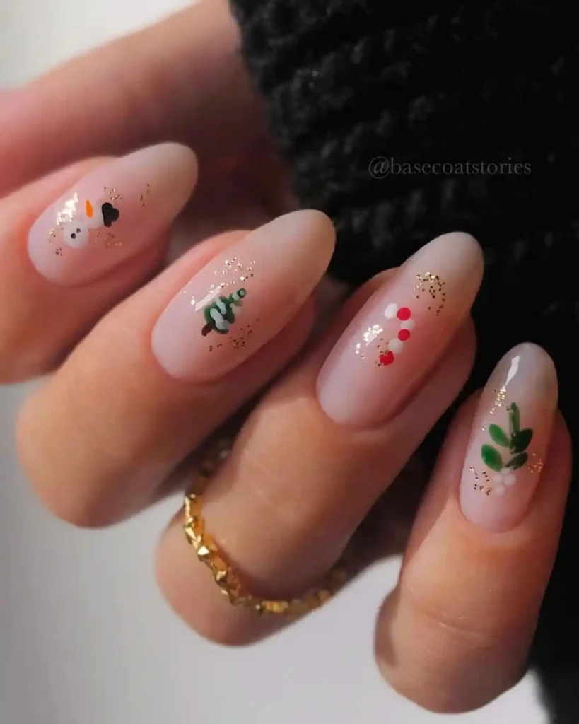 Simple Christmas nail idea with Christmas tree, snowman, candy cane, leaves patterns, and glitter details.