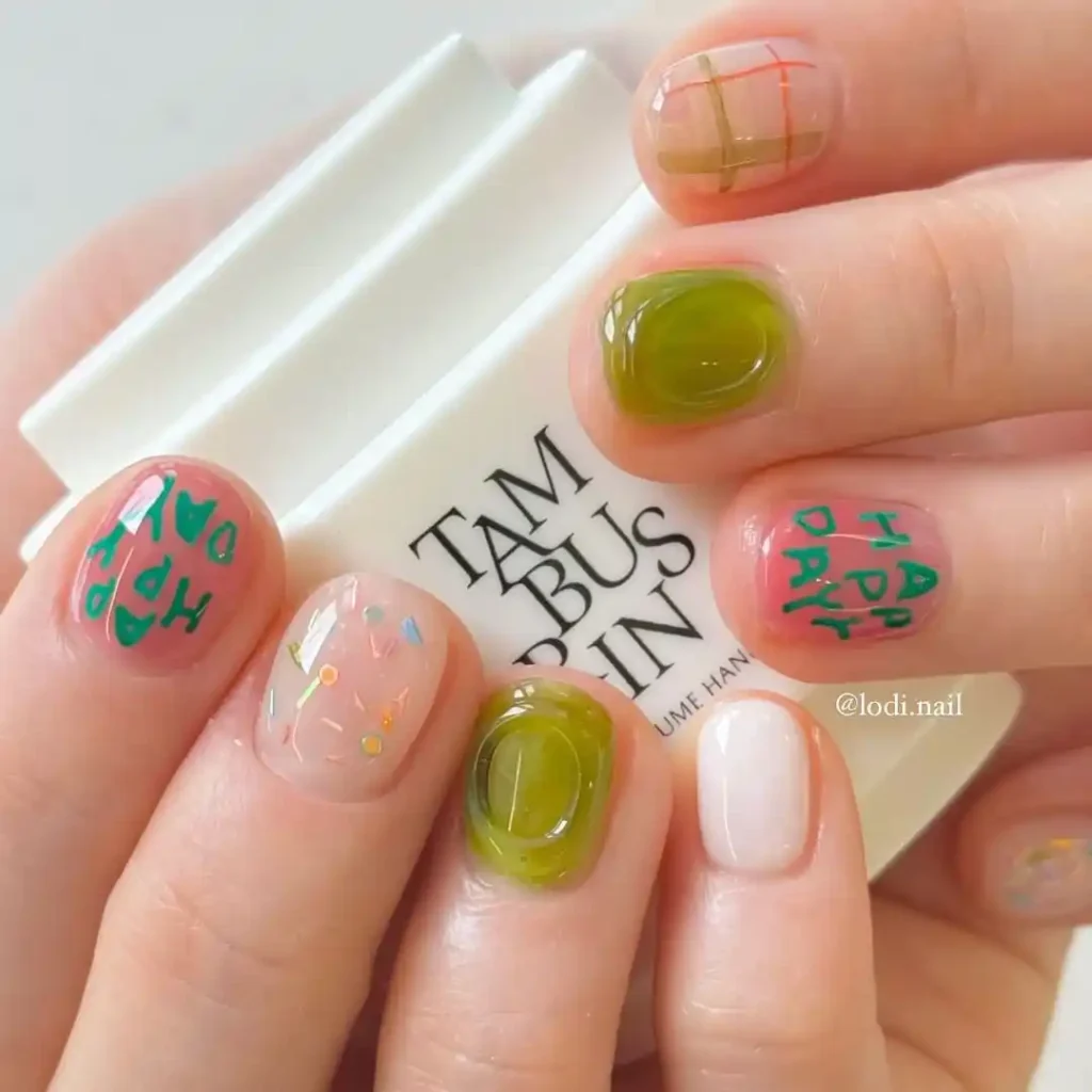 Cute green, pink, and orange manicures with 3D art, sprinkles, and checkered designs. 