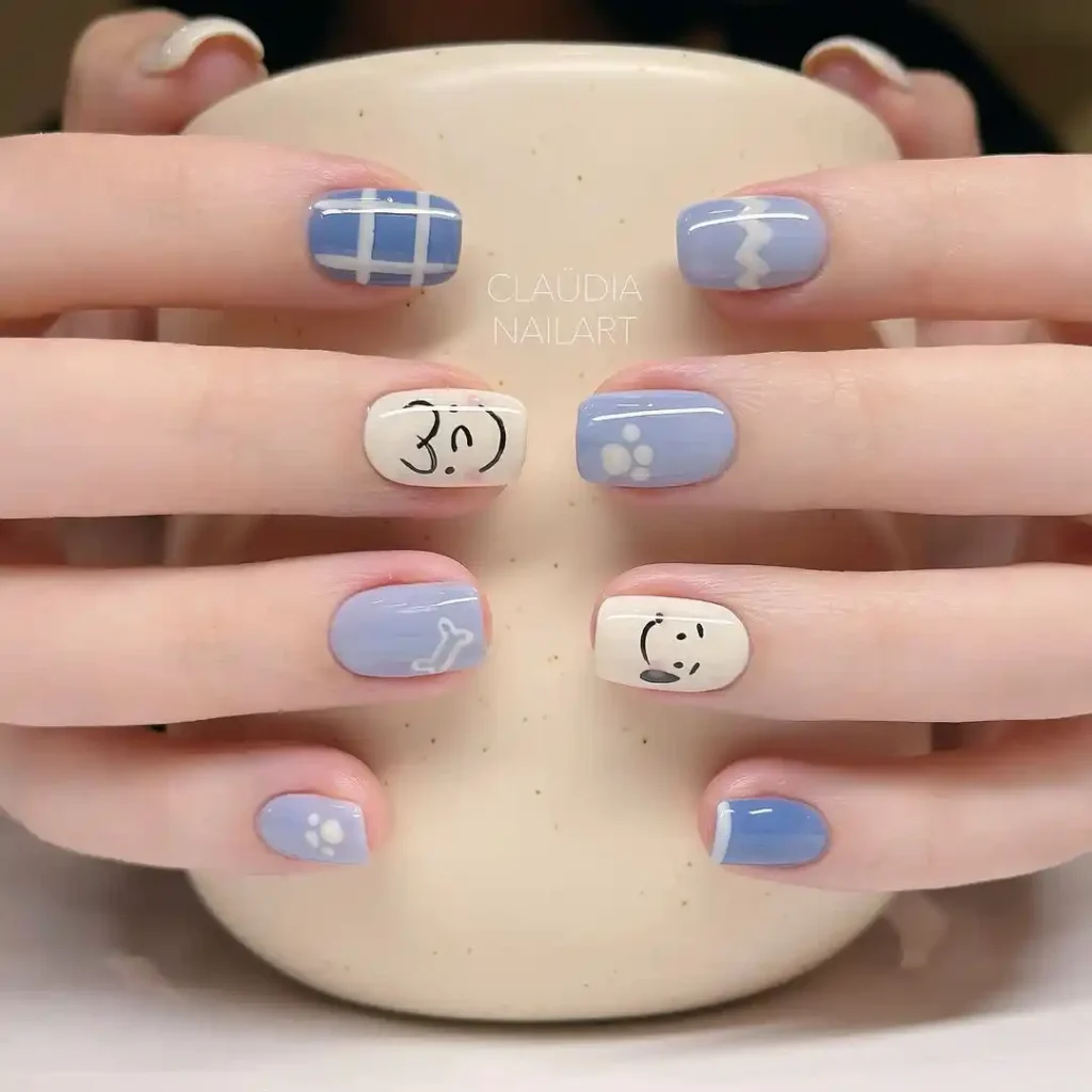 Cute summer nails with blue and white puppy nail art.