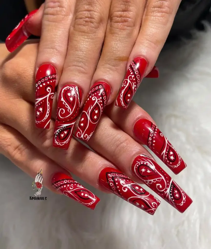 Long coffin nails with red traditional bandana nail art.