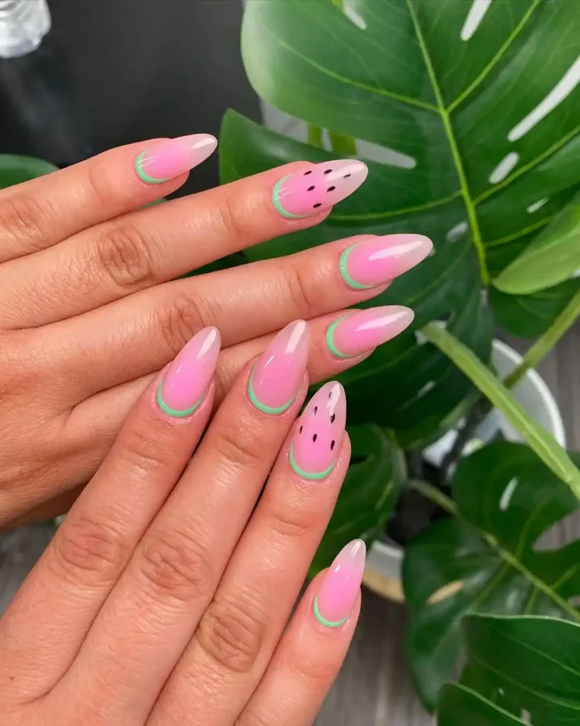 Cute watermelon nails with reverse French for summer. 