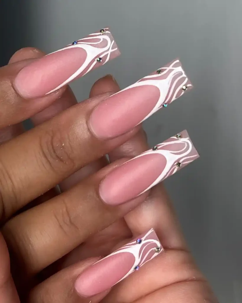 Long square acrylic nails with matte nude nail base and white French tips art. 