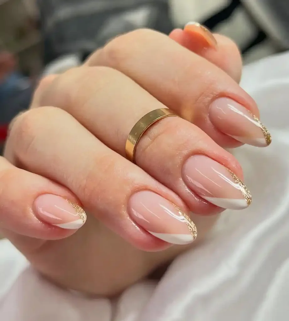 Simple wedding nail idea with glitter and white V tips. 