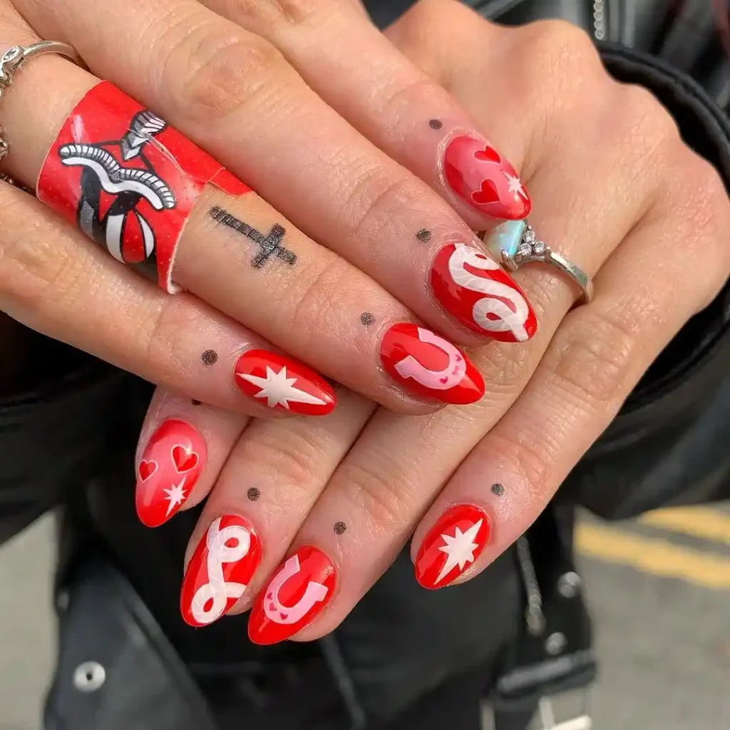 Bright red nails with cowgirl theme nail art.