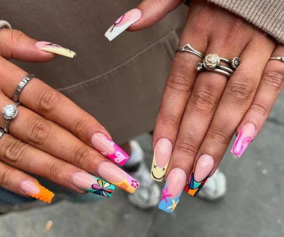 Colorful birthday nails with mixed freestyle nail art. 