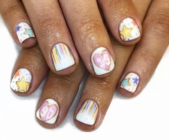 90s cute birthday nail art on short white nails.