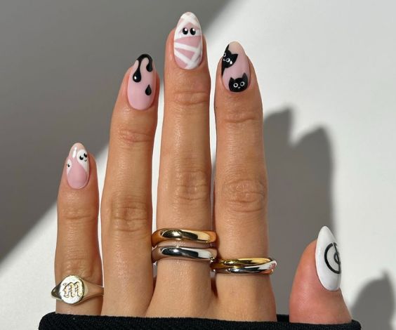 Black and white nail color with simple designs. 