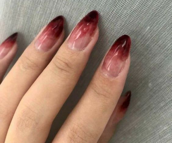 Blood ombre nail effect on almond nails. 