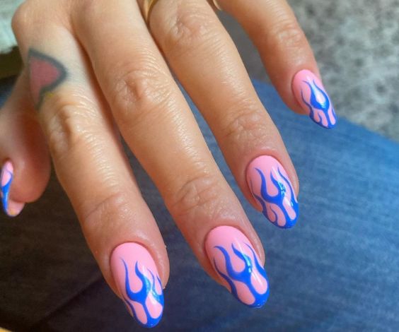 Cute light blue French tips with tiny butterfly designs. 