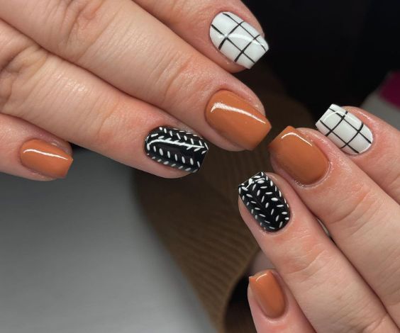 Simple black and brown nails with check and sweater designs