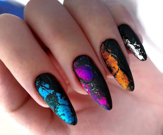 Matte black almond nails with colorful foil and gel art.