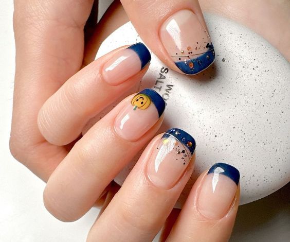 Cute blue squoval nail tips with simple art. 