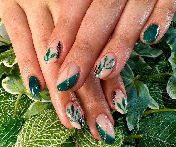 Leafy nail art with dark green nail color.