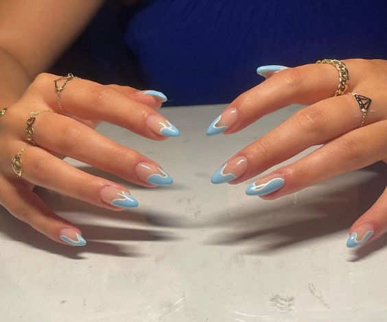 French tips with light blue and white dripping art.