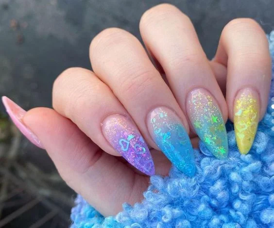 Almond nails with multicolored holographic glitters. 