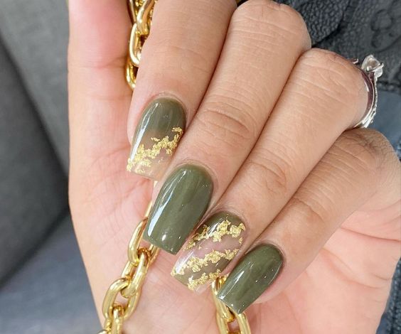 Olive green nails with gold foil nail art. 
