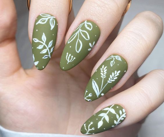 Matte green nails with simple abstract art