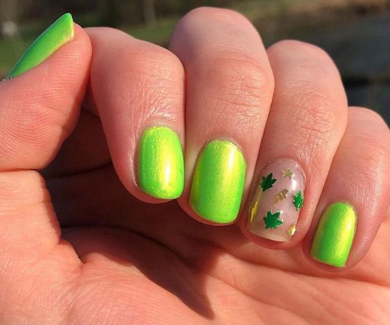 Almond nails with groovy designs and neon nail color. 
