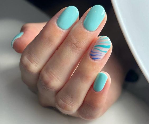 Light blue abstract nail art for a beach day. 