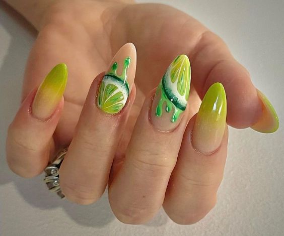 Acrylic nails with lime green nail color and lime art. 
