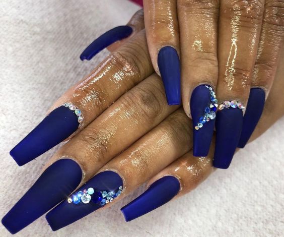 Matte blue coffin nails with 3D crystals.