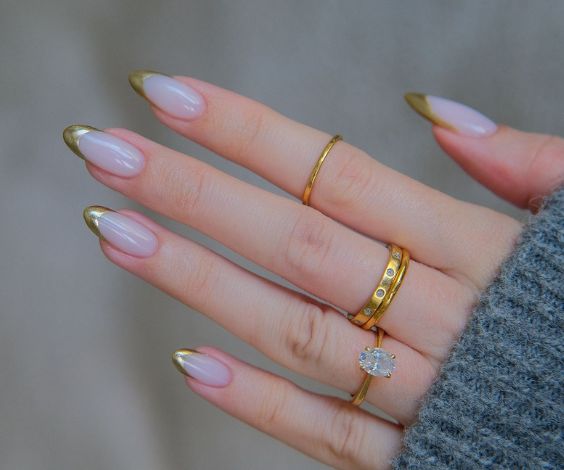 Popular metallic gold French tips for Thanksgiving manicure