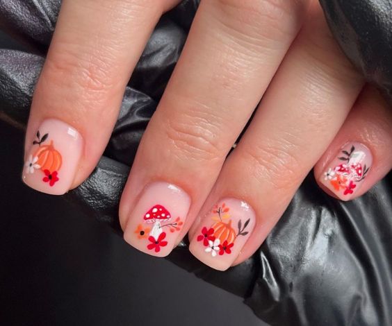 Short natural nails with pumpkin and mushroom art