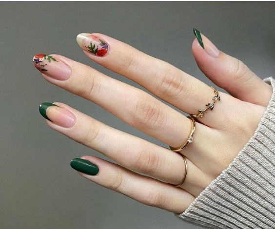 Flower nail art with green nail color and French tips