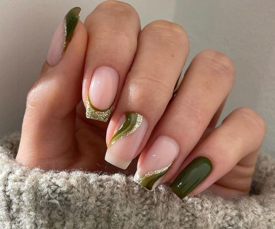 French tips and swirl nail art with gold glitter and olive green nail polish. 
