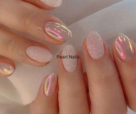 Glitter and metallic nail art for glossy short nail manicures. 