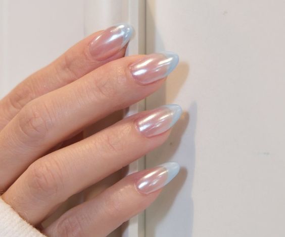 Light blue French tips with chrome effect. 