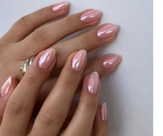 Simple short pink nails with a crystal chrome effect.